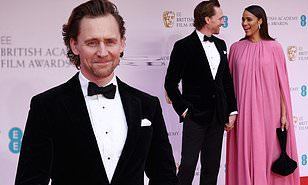 BAFTA 2022 Film Awards: Tom Hiddleston snuggles up to girlfriend Zawe Ashton, who shines in a flowing pink gown on the red carpet